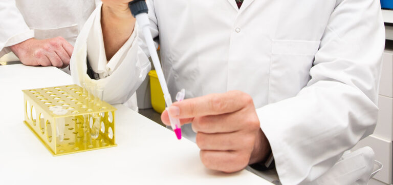 Test tube and scientist